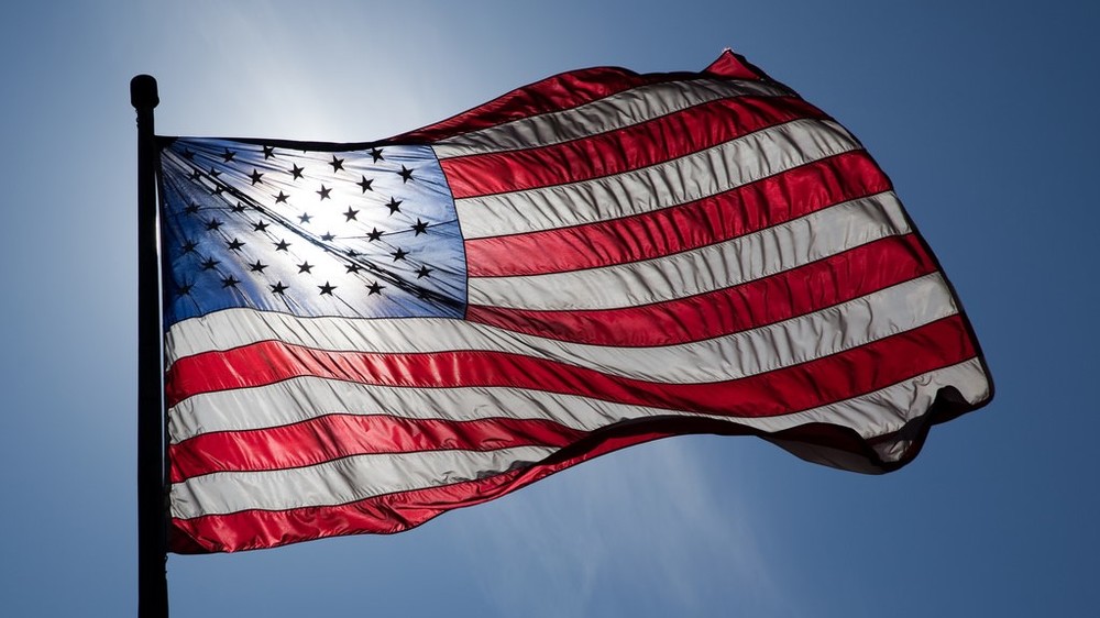 backlit American Flag in the wind