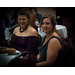 vignette of two women smiling at camera from banquet table