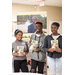 three students with &quot;I ain't going to college&quot; books