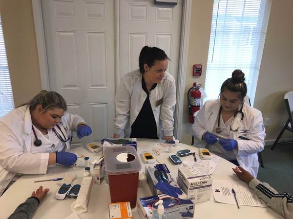 nursing students preparing free health screening tests
