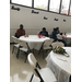 Residents eating at Christmas party inside at round table