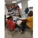 Nurse students  providing finger prick for blood test health screening