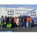Highway to Hope RV with Florence Housing Authority staff standing outside the clinic on wheels